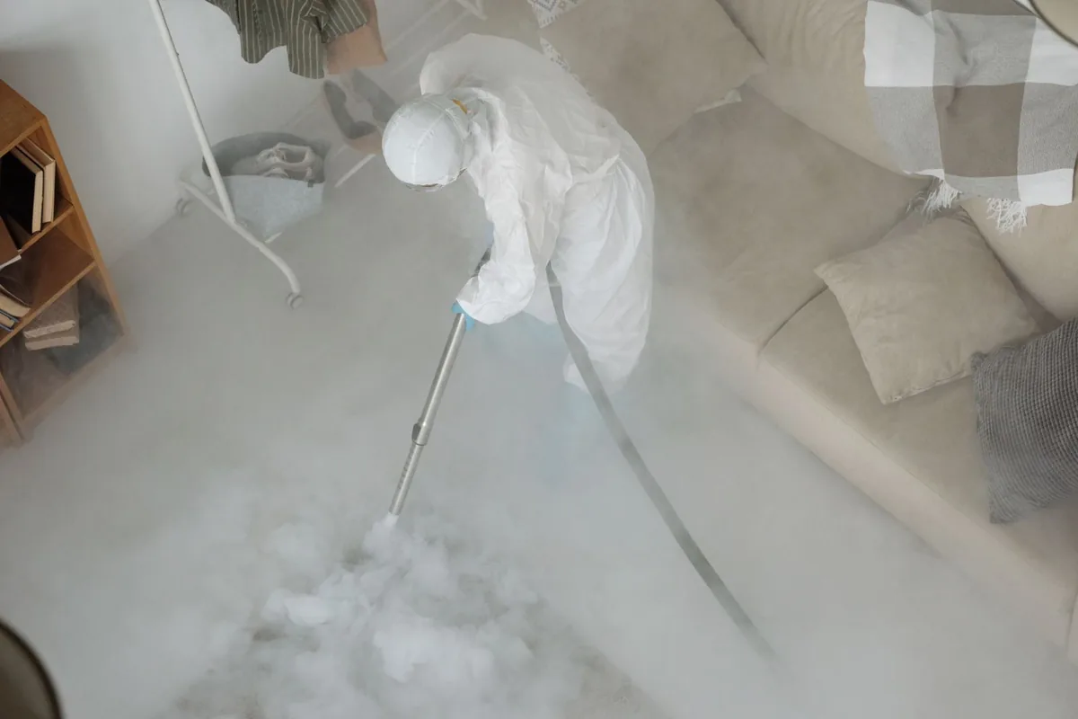 Biohazard cleanup technician in protective equipment, Spencer, TN